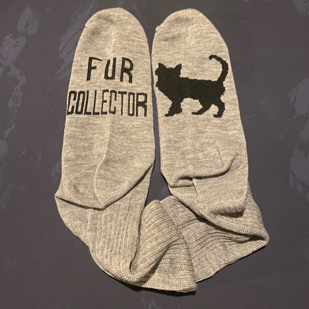 Fur Collector Socks. Dark gray fun slogan soles.